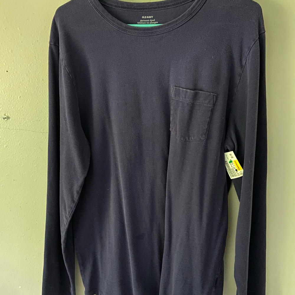 Long sleeve blue shirt with a pocket.